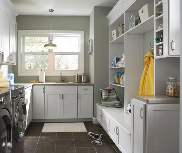 Laundry room cabinets in painted white Maple by Aristokraft Cabinetry