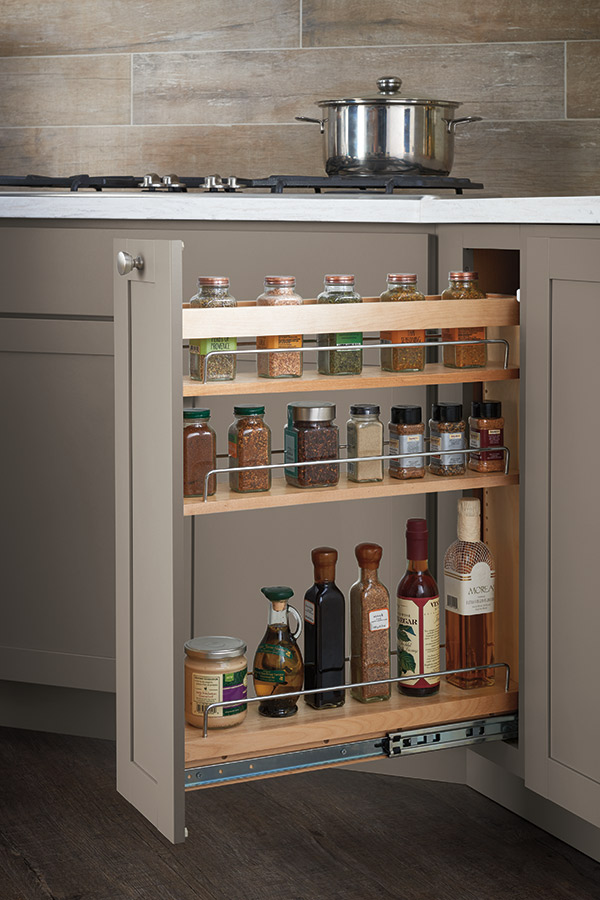 base pantry pullout cabinet stocked with spices