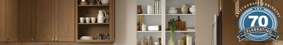 medium brown stained cabinetry with open shelves and the aristokraft cabinetry 70 years celebration seal